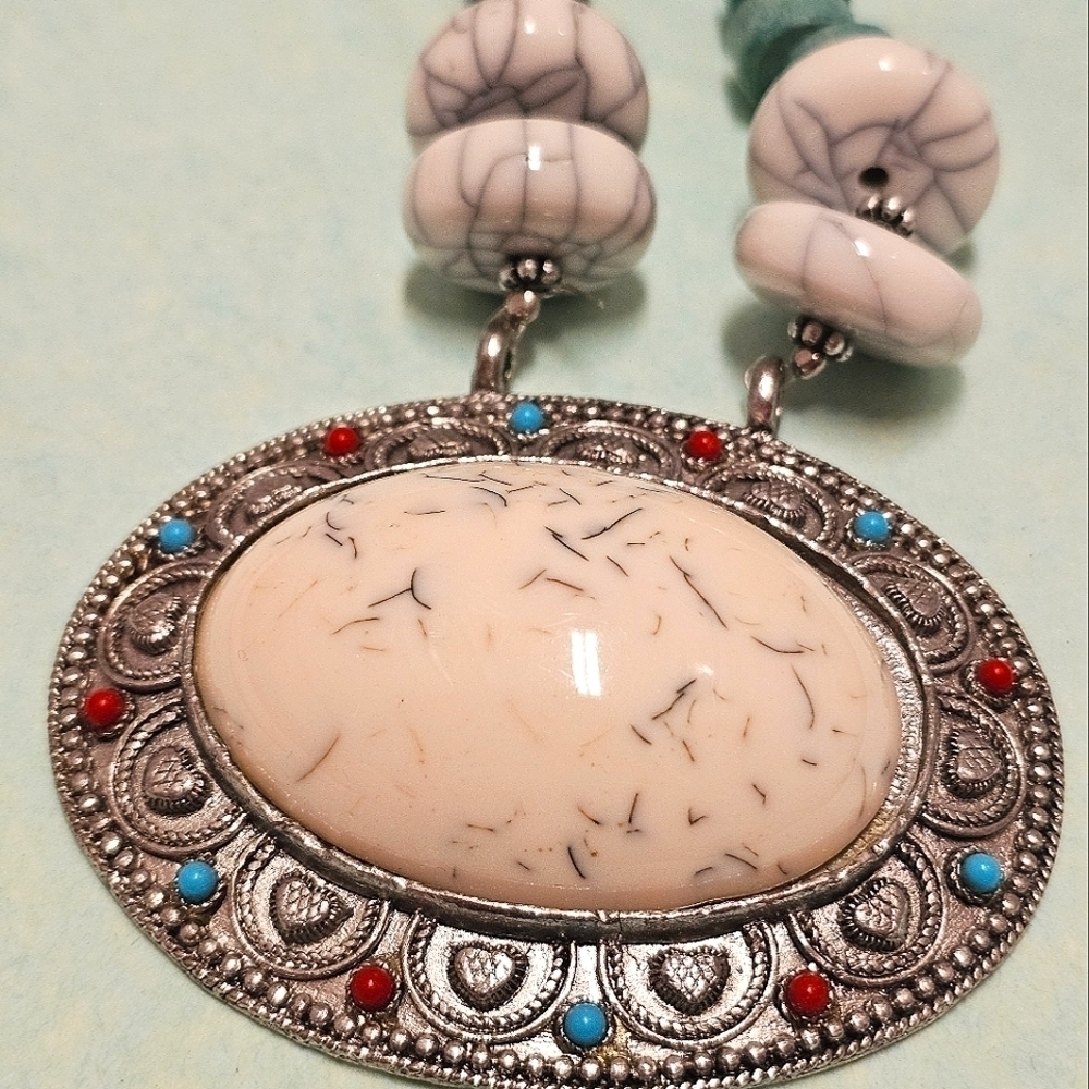 Elegant Silver Pendant Necklace with Cream and Turquoise Accents